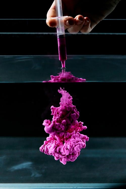 High-Speed Photography of Purple Ink Diffusion in Water